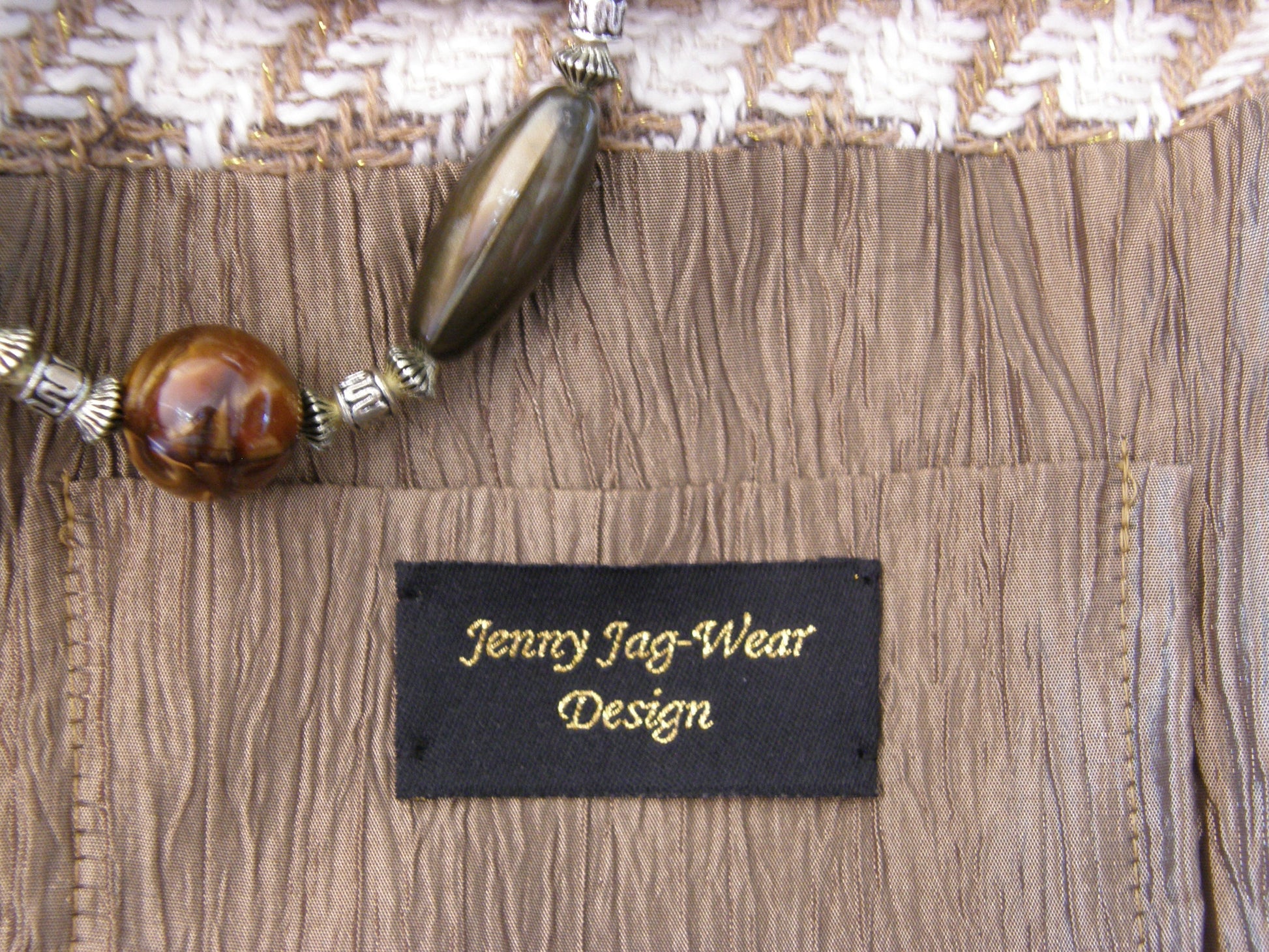 Close up showing  gold taffeta inside lining of purse