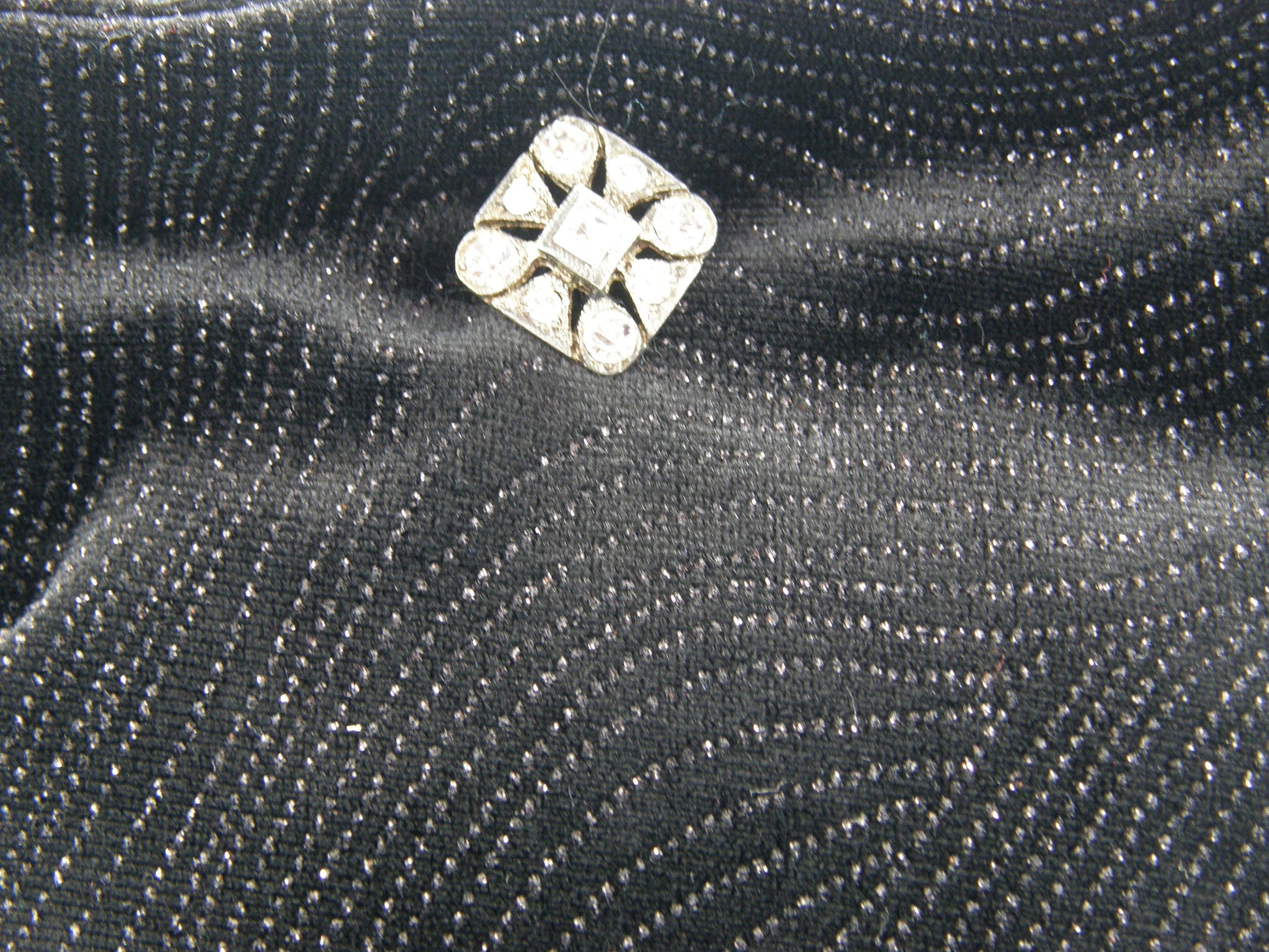 Black and Silver Evening Bag from Jenny Jag-Wear Design. Photo shows closeup image of the black holiday fabric with silver glitter. The Merle Collection from Jenny Jag-Wear Design.