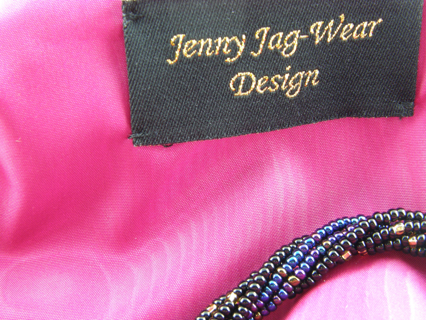 Iridescent Evening Bag from Jenny Jag-Wear Design. The photo demonstrates the hot pink inside lining.  A beautiful contrasting colour to this exquisite evening bag. The Liza Collection by Jenny Jag-Wear Design.