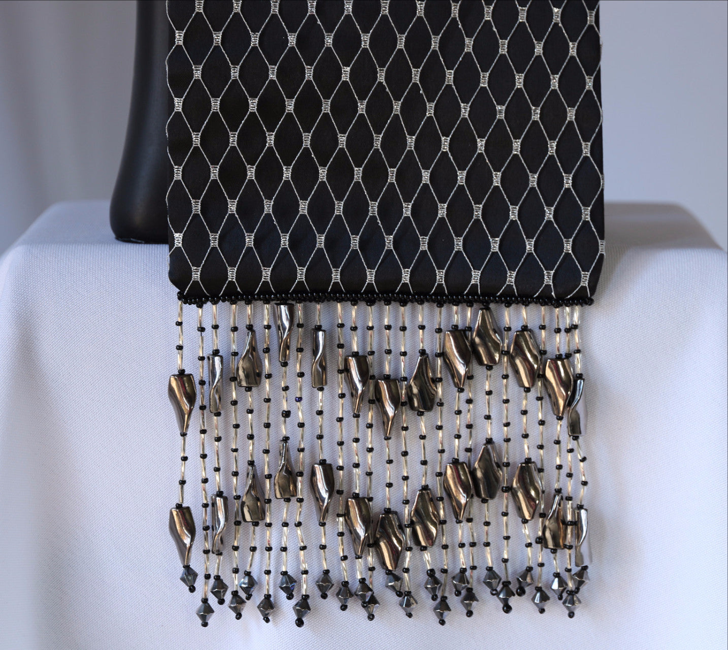 Black and Silver Evening Bag from Jenny Jag-Wear Design.  Photo shows close up image to the black satin and silver netting evening bag, and the beaded fringe. The Zara Collection from Jenny Jag-Wear Design.
