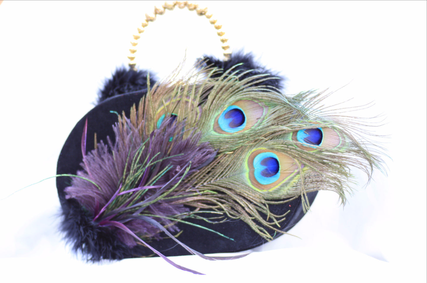 novelty wood based purse designed in black velvet and embellished with peacock feathers and gold handle